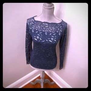 Stretch lace dressy shirt, with floral pattern.